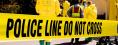 Police Tape with safety/Hazmat workers in the background